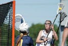 Prior Lake High School's Payton Bloedow (20) scored on Break School goalie Lydia Akins (0) in the second half of the Girls Lacrosse State Tournament S