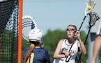 Prior Lake High School's Payton Bloedow (20) scored on Break School goalie Lydia Akins (0) in the second half of the Girls Lacrosse State Tournament S