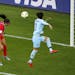 United States’ Alex Morgan, left, headed the ball past Thailand’s Natthakarn Chinwong to score her first of five goals in the 13-0 rout to open th