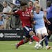 FC Bayern's Chris Richards, left, takes the ball from Manchester City midfielder Oleksandr Zinchenko in a July 2018 International Champions Cup tourna