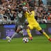 Minnesota United defender Romain Metanire, left, battled the Columbus Crew’s David Accam in the first half of a May 18 game at Allianz Field.