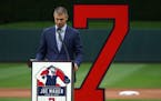 Former Minnesota Twins star Joe Mauer fought back tears as he spoke during a pregame ceremony to retire his number 7 Saturday.