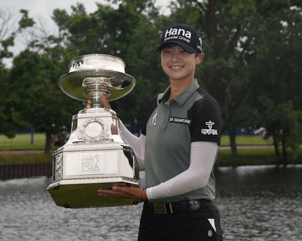 Sung Hyun Park posed with the championship trophy after making a birdie on the second hole of a playoff on the 16th hole to win the KPMG Women's PGA C