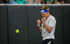 Mounds View freshman Bjorn Swenson celebrates his Class 2A boys’ tennis singles state championship victory over Varun Iyer of Rochester Century at t