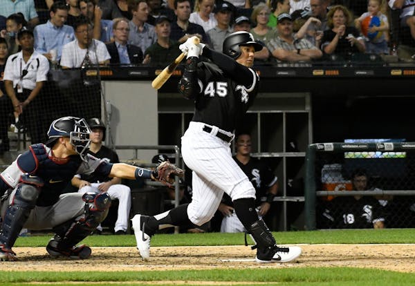 Jon Jay of the White Sox hits an RBI single against the Twins during the fifth inning at Guaranteed Rate Field in Chicago on Friday