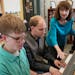 Pianists Noah Johnson, left, and Brandon Leu practiced for an upcoming recital as their teacher Diana Bearmon watched and listened.