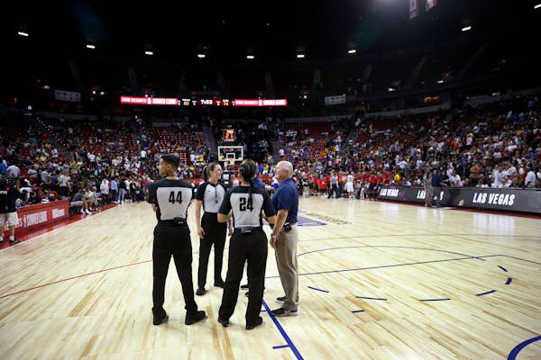 Officials confer after an NBA summer league basketball game between the New York Knicks and the New Orleans Pelicans was stopped following an earthqua