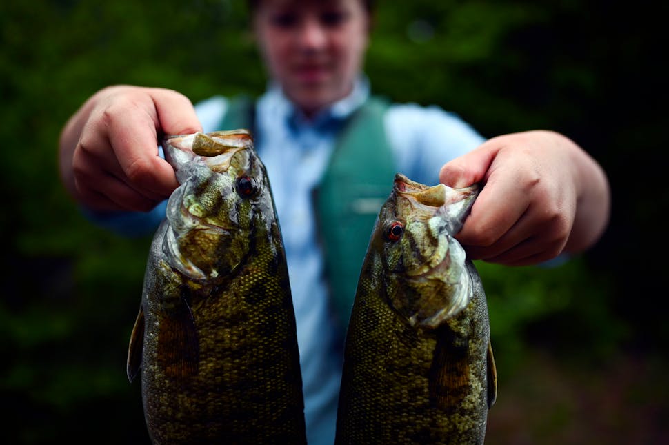 Aidan Jones showed off two nice smallmouth bass on the first night of the trip. They were quickly cleaned and fried for dinner.