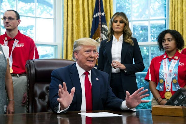 President Donald Trump speaks to reporters while meeting with U.S. Special Olympics athletes and staff in the Oval Office, at the White House in Washi