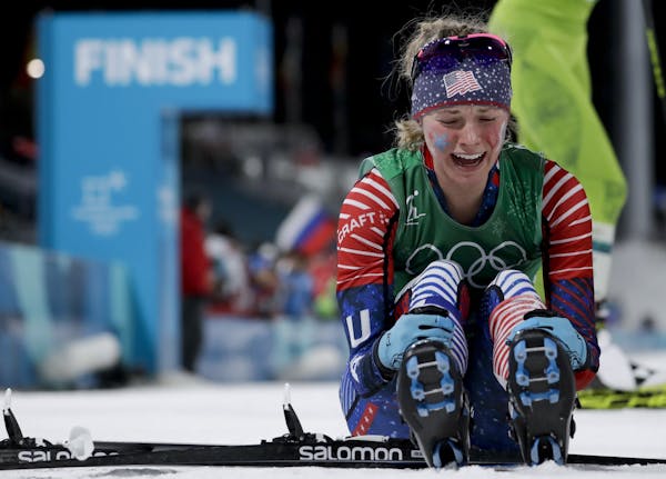 Jessica Diggins celebrates after winning the gold medal in the during women's team sprint freestyle cross-country skiing final at the 2018 Winter Olym