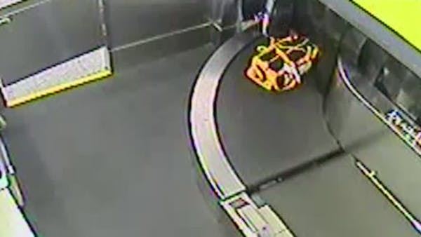 Toddler takes wild ride on airport luggage belt