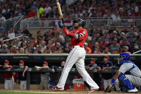 Twins designated hitter Nelson Cruz followed through with his swing after hitting a solo home run against the Kansas City Royals in the bottom of the 