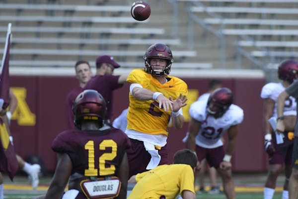 Gophers quarterback Tanner Morgan (2) passed the ball during practice Saturday.