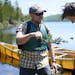 Tony Jones baptized his 14-year old son, Aidan, as a neophyte voyageur at the completion of the Height of Land Portage in the BWCA. ] Aaron Lavinsky �