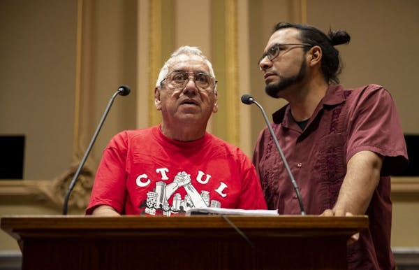Humberto Miceli, left, and his friend and translator, Israel Aranda, testified in July before the Minneapolis City Council about Miceli's experiences 
