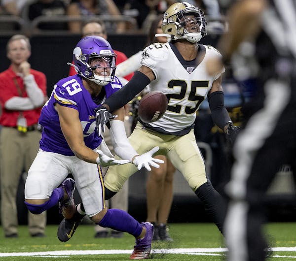 Vikings receiver Adam Thielen caught a 35-yard pass while being defended by Eli Apple in the first quarter.