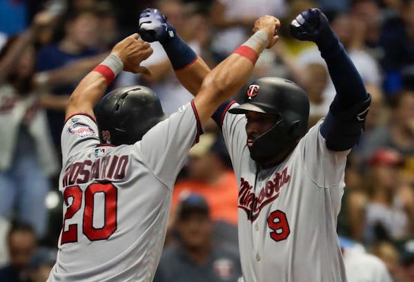 The Twins' Marwin Gonzalez, right, celebrated with Eddie Rosario after hitting a three-run home run in the eighth inning of a 7-5 victory over the Bre