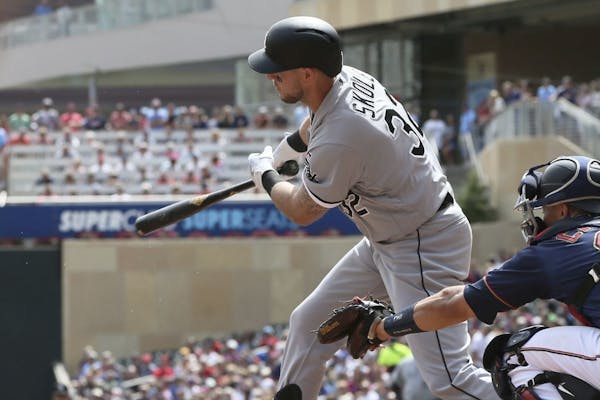 Chicago White Sox's Matt Skole drives in a run on a single off Minnesota Twins pitcher Jake Odorizzi in the first inning of a baseball game Wednesday,