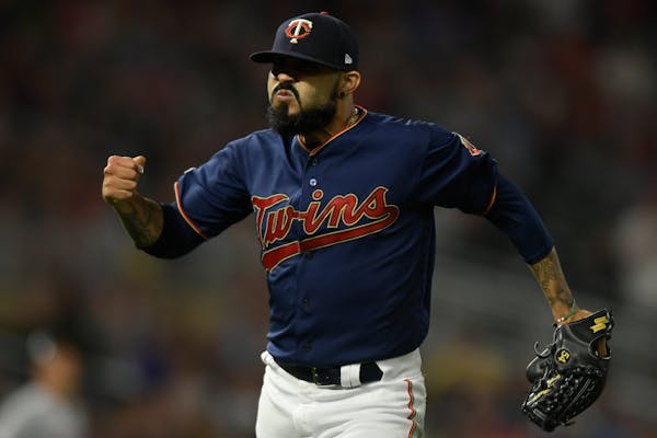 Twins relief pitcher Sergio Romo celebrated after the end of the top of the sixth inning against the Cleveland Indians.