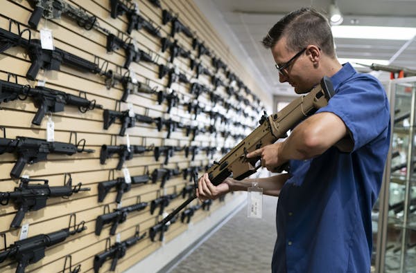 Kyle Rosenquist checked out a semiautomatic rifle at Bill’s Gun Shop in Robbinsdale. He plans to join the nearly 290,000 gun-permit holders in the s