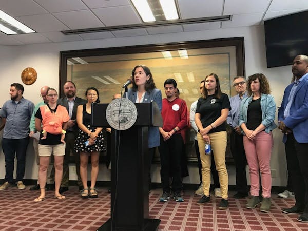 Minneapolis City Council President Lisa Bender, surrounded by renters and tenant advocates, spoke Thursday about a proposed ordinance limiting screeni