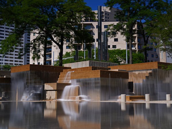 The fountains at the renovated Peavey Plaza in downtown Minneapolis flowed over the reflecting pool.
