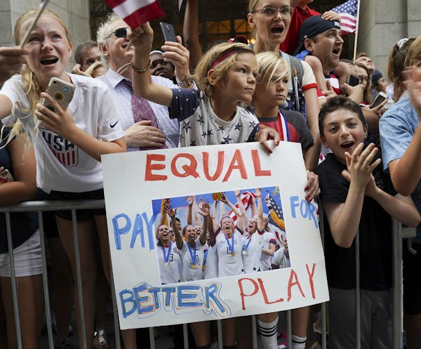 Fans and players celebrate the U.S. Women’s Soccer Team winning the 2019 World Cup during a ‘Canyon of Heroes’ ticker tape parade in Lower Manha
