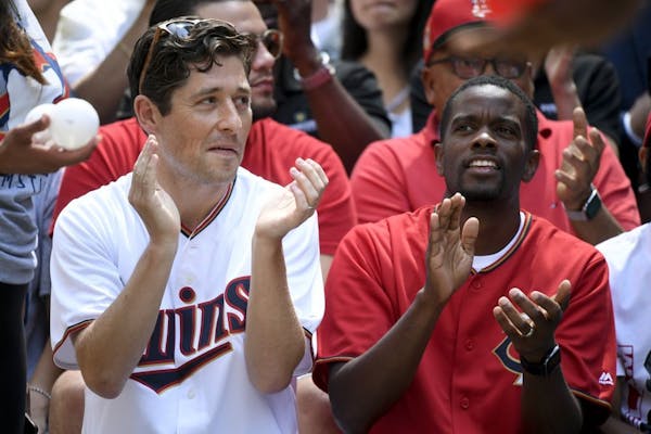 Twin Cities mayors Jacob Frey, of Minneapolis, and Melvin Carter, of St. Paul, watched the Twins play whiffle ball Tuesday on Nicollet Mall in July.