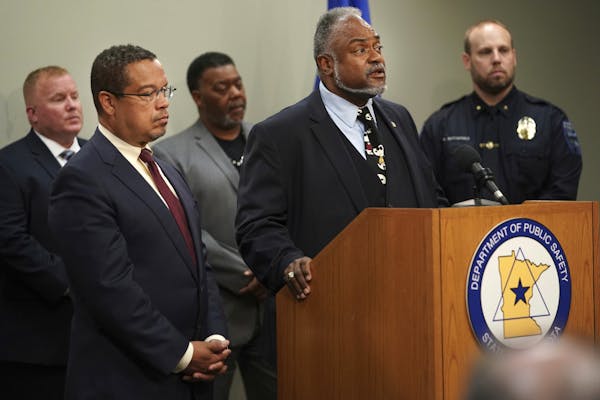 Attorney General Keith Ellison and Public Safety Commissioner John Harrington announce a working group and public hearings about what they call police