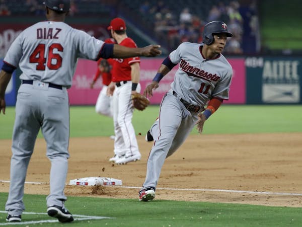Twins third base coach Tony Diaz sends Jorge Polanco home, scoring on a C.J. Cron single in the fourth inning to give the Twins a 10-0 lead.