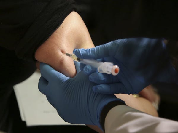 A woman received a measles, mumps and rubella vaccine.
