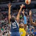 Damiris Dantas, left, and Sylvia Fowles, right, blocked Chicago's Cheyenne Parker