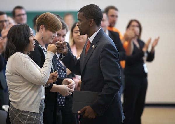 St. Paul Mayor Melvin Carter fistbumped his wife Sakeena after giving his 2020 budget address at Frogtown Community Center on Thursday.