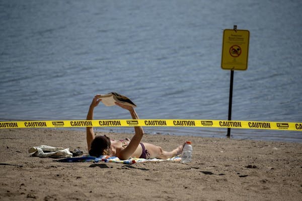 Rachel Soukup was surprised to see very few people Friday at Lake Nokomis beach, one of the many in Minneapolis closed because of illness reports.