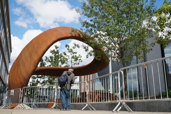 The 10-ton sculpture called “Nimbus,” outside the Hennepin County Central Library in downtown Minneapolis has been fenced off for a second time th
