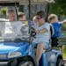Jo Ann Monnens picked up her husband, Paul, in the couple’s electric blue golf cart as she gave her grandchildren a ride through their Shakopee neig