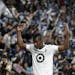 Minnesota United forward Darwin Quintero, shown trying to get supporters into a game earlier this season, said he was frustrated and hurt about not st