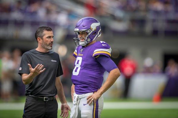 Vikings offensive coordinator Kevin Stefanski spoke with quarterback Kirk Cousins during Week 3 of the preseason vs. the Arizona Cardinals