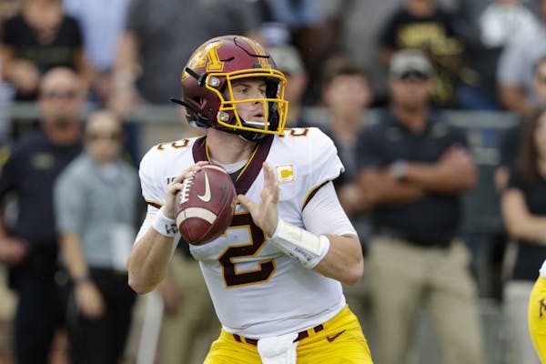 Minnesota quarterback Tanner Morgan (2) throws against Purdue during the first half of an NCAA college football game in West Lafayette, Ind., Saturday