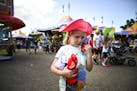"I want the piggy," cried five-year old Veda Reinitz-Albers to her father Mark, of Henderson, Minn., after they called it quits on playing carnival ga