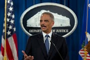 Attorney General Eric Holder spoke at the U.S. Justice Department in 2015 to discuss the fatal shooting of Michael Brown in Ferguson, Mo., in 2014. Ha