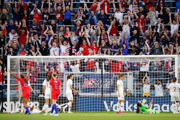 USA fans react after USA forward Carli Lloyd (10) scored a goal during the first half.
