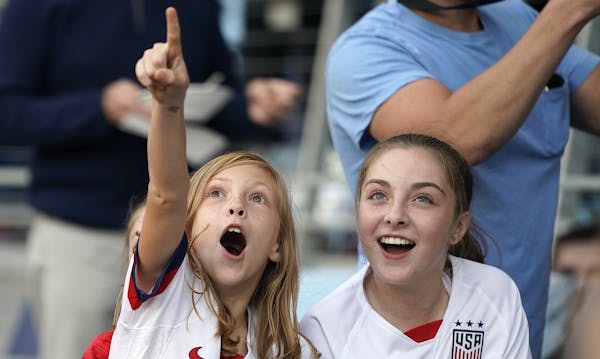 Two young soccer fans cheered as the members of the U.S. Women's National Team players entered Allianz Field on Tuesday night before the exhibition ma