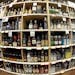 This 2016 photo made with a fisheye lens shows bottles of alcohol during a tour of a state liquor store in Salt Lake City.