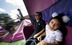 Yashira Sanchez screamed as she rode the Tirt-a-whirl with her dad Gustavo Sanchez, of Columbia Heights, at the Minnesota State Fair in Falcon Heights