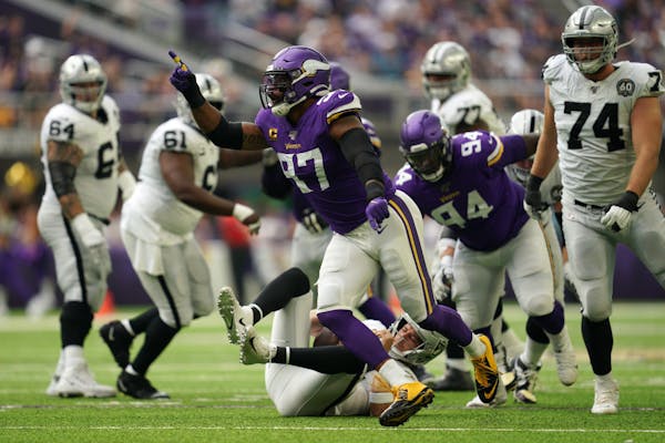Minnesota Vikings defensive end Everson Griffen (97) celebrated after he sacked Oakland Raiders quarterback Derek Carr (4) in the second quarter.