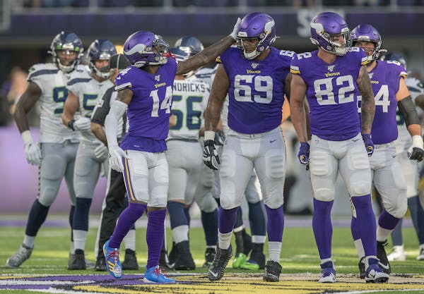 Rashod Hill (69) got a pat on the helmet from Vikings wide receiver Stefon Diggs during a preseason game against Seattle on Aug. 18.