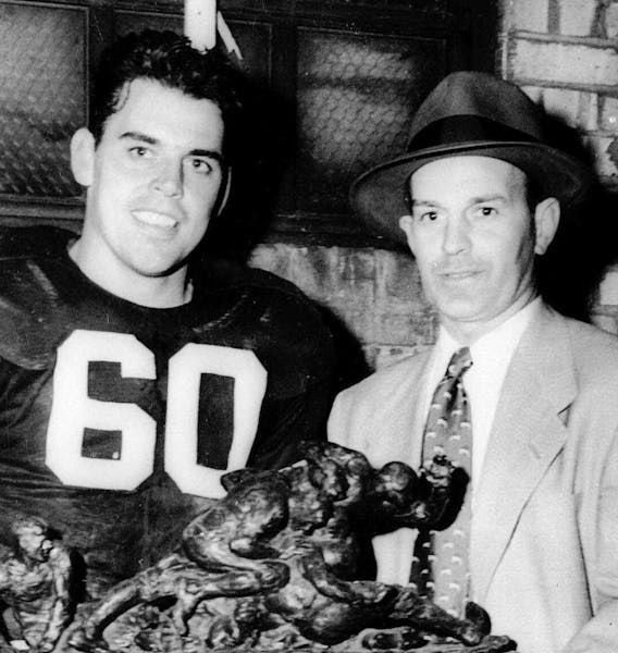 Otto Graham (left) and his coach Paul Brown in 1950.