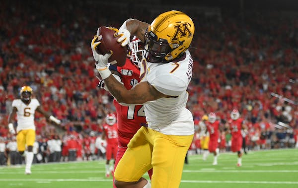 Gophers wide receiver Chris Autman-Bell made a touchdown catch with less than a minute left in the fourth quarter to tie the game while being defended