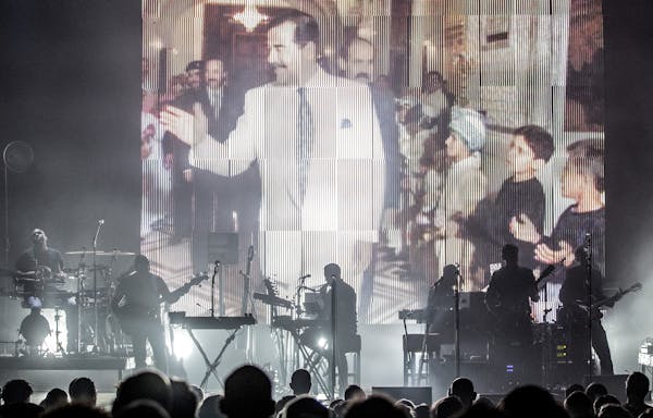 Massive Attack’s performance at the Palace Theatre in St. Paul featured video footage of the Iraq War and Saddam Hussein. ] CARLOS GONZALEZ • cgon